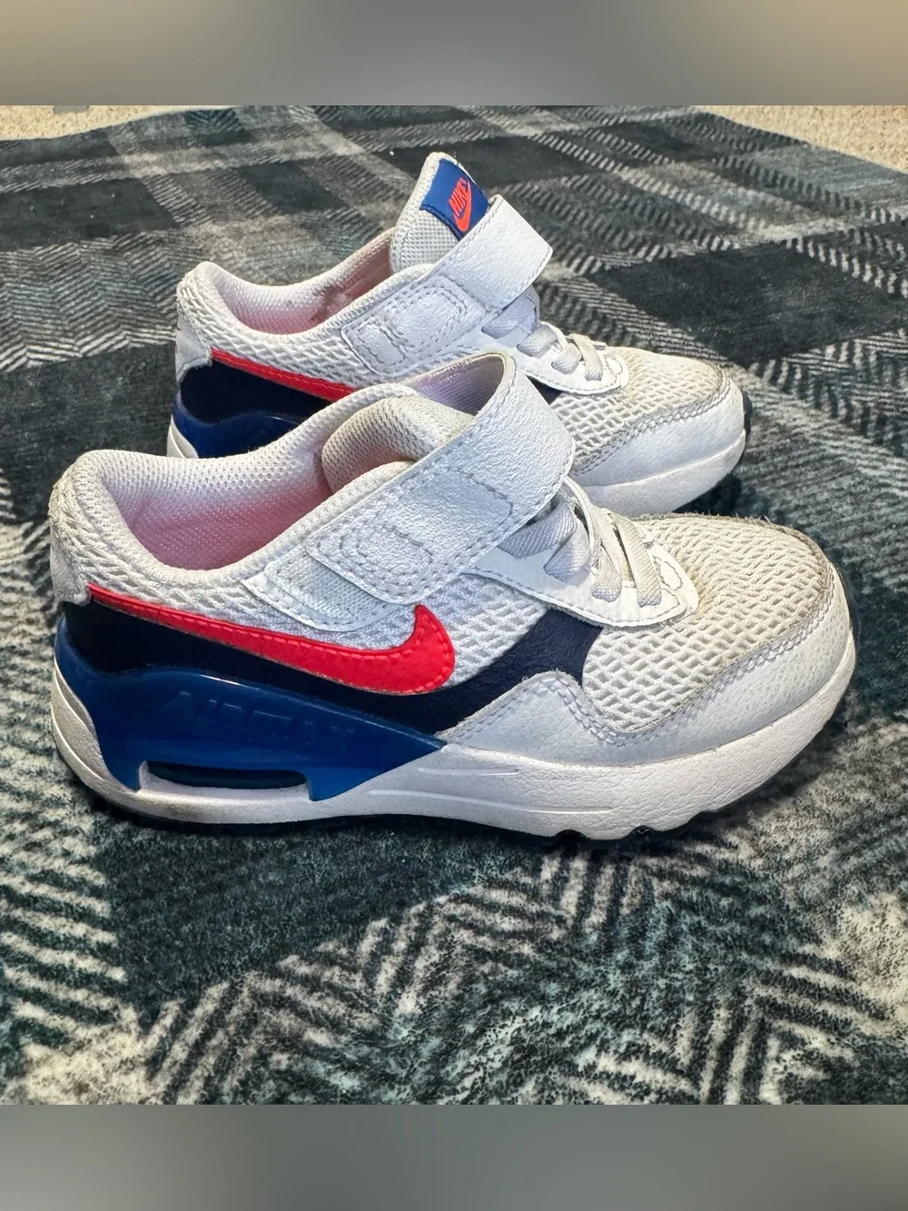 Nike Air Kids White with bright orangish/red Swoosh and Blue Accents